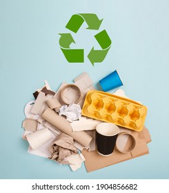 Separate Collection Of Paper Garbage. Paper Stuff For Recycle On Blue Background. Eco Friendly Concept. Recyclable Paper Waste. Cardboard, Craft Paper, Egg Carton, Disposable Cup. Zero Waste.