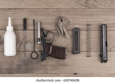 Separate Parts Of Pistol And Cleaning Kit, Set