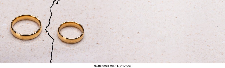 Separated Broken Wedding And Engagement Rings. Couple Divorce 