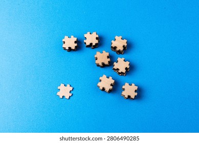 Separated puzzle pieces representing cohesion challenge and unity need