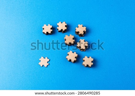 Separated puzzle pieces representing cohesion challenge and unity need