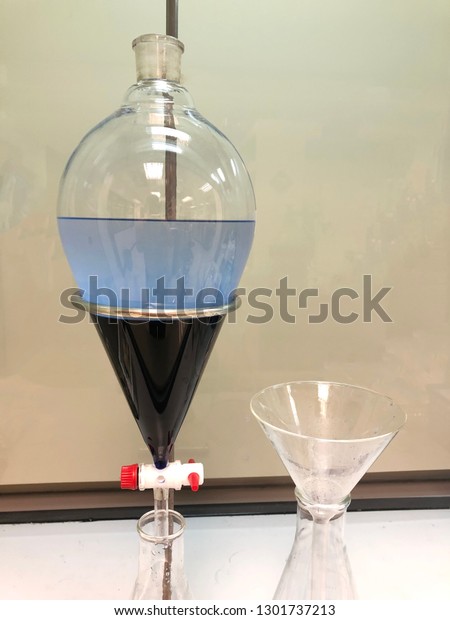 separating natural product\
use dichloromethane with water have two layer blue and white in\
separating funnel