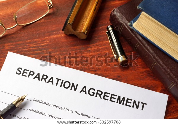 Separation agreement\
form on an office\
table.