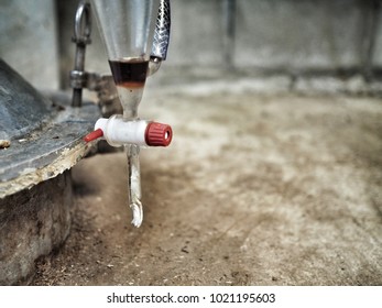 Separation Aroma Oil After Distillation By Liquid - Liquid Extraction Technique With Separatory Funnel. Brown Liquid Is Agarwood Essential Oil And Transparent Liquid Is Water.