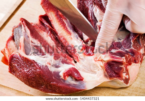 Separation of a raw mutton meat with rib for\
meat portions