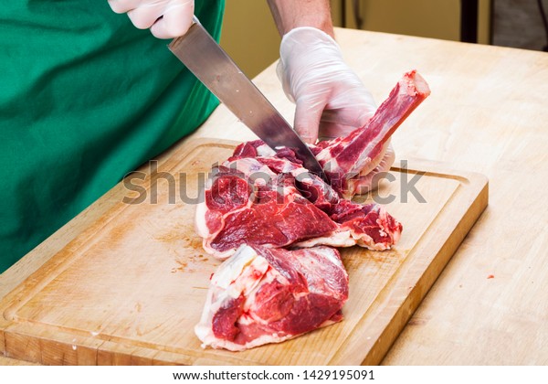 Separation of a raw mutton meat with rib for\
meat portions