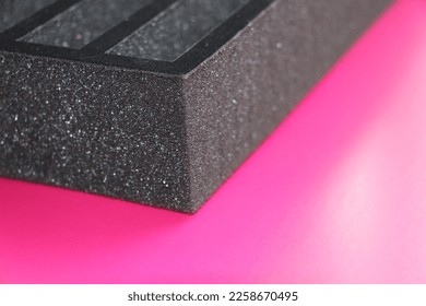 A separator made of black sponge, prepared to put the product in the box - Shutterstock ID 2258670495