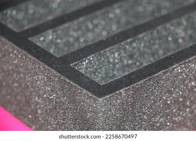 A separator made of black sponge, prepared to put the product in the box - Shutterstock ID 2258670497