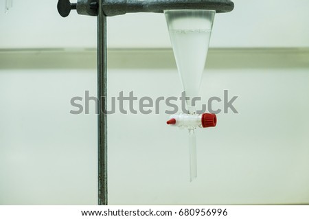 The separatory funnel contain the liquid separated in 2 layers of aqueous and non aqueous organic solvent, extraction method of organic compound in pharmaceutical quality control laboratory