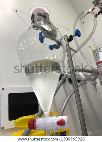 Separatory funnel in science laboratory 