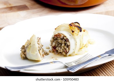 Sepia Filled With Pearl Barley Baked With Onion