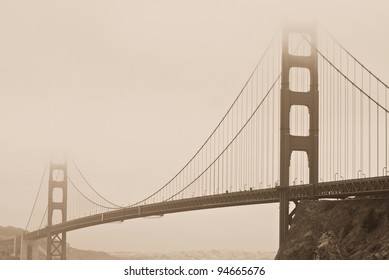 Sepia tone image of Golden Gate Bridge shrouded in fog in San Francisco - Powered by Shutterstock