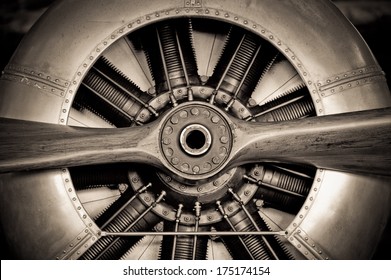 sepia toned vintage aircraft engine and propeller closeup