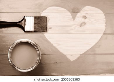 A sepia-toned image of a paintbrush and can on a wooden surface, showcasing artistic creativity. Demonstrating color of 2025 year. - Powered by Shutterstock