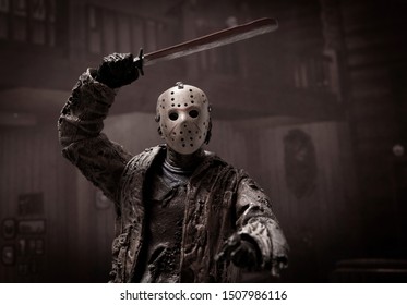 SEPT 17 2019: Horror movie slasher Jason Voorhees stalking a victim inside a cabin at Camp Crystal Lake - Neca Jason action figure