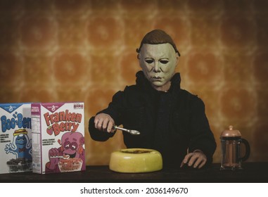 SEPT 3 2021: Halloween slasher Michael Myers eating Frankenberry cereal in a retro kitchen - Neca action figure