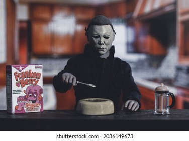 SEPT 3 2021: Halloween slasher Michael Myers eating Frankenberry cereal in a retro kitchen - Neca action figure