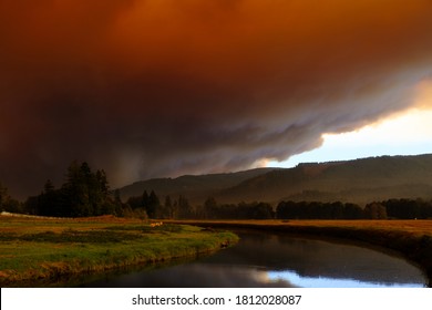 Sept 9, 2020  Walterville Oregon - A Large Glowing Cloud From Wildfires Turn The Sky Red. Black Skies Are Stagnant Through The Willamette Valley From The McKenzie River Fires.