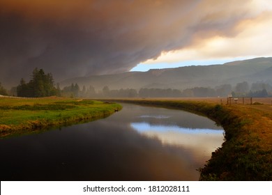 Sept 9, 2020  Walterville Oregon - A Large Glowing Cloud From Wildfires Turn The Sky Red. Black Skies Are Stagnant Through The Willamette Valley From The McKenzie River Fires.