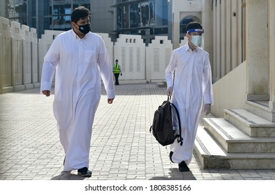 SEPTEMBER 01,2020-DOHA,QATAR:Students Wearing Protective Face Masks Arrive For Their First Day Of School Of Reopen Following Closure Due To The COVID-19 Coronavirus In Doha,Qatar