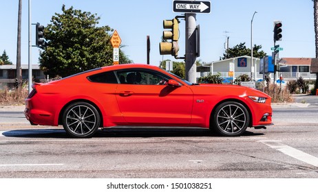 September 1, 2019 Sunnyvale / CA / USA - Orange Colored Ford Mustang Side View