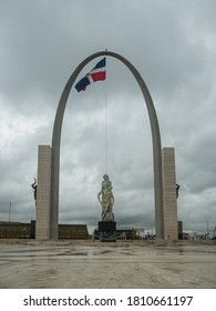 SEPTEMBER 1, 2020 PLAZA DE LA BANDERA. Santo Dominica Dominican Republic. Dramatic Image Of A National  Monument, With Big Arch And Dominican Flag On A Cloudy Day. 