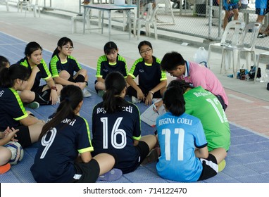 September 10th, 2017. Chiang Mai, Thailand. Girl School Football Team Sitting In Circle Listening To Teacher Coaching For Game Plan Before Playing The Match With Opposite Team In Good Health Program.