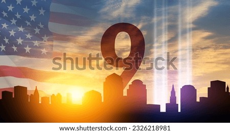 September 11 Tribute In Light Art Installation in the Lower Manhattan New York City Skyline at Sunset with USA flag and birds flying up like souls. 9.11 date concept. American Patriot Day banner.
