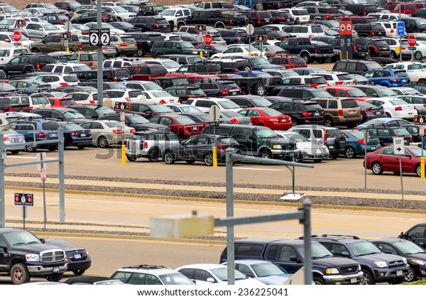 September 12, 2014: DIA, DEN, Denver International\
Airport - parking lot with\
cars