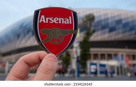 September 12, 2021, London, UK. Arsenal F.C. football club emblem against the backdrop of a modern stadium.