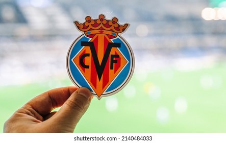 September 12, 2021, Villarreal, Spain. The emblem of the football club Villarreal CF against the background of a modern stadium.