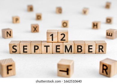 September 12 - from wooden blocks with letters, important date concept, white background random letters around - Shutterstock ID 1662510640