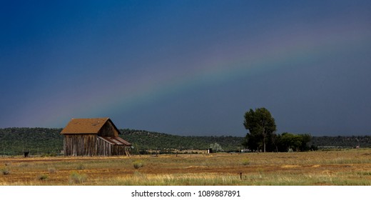 September 14, 2017 - Dramatic view of  rainbow over a western barn near Norwood Colorado in the LaSalle Mountains