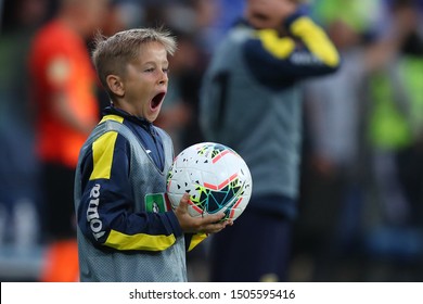 SEPTEMBER 14, 2019 - KHARKIV, UKRAINE: Little Ball-boy Portrait With Ball In Hands, Yawns. Ukrainian Premier League. FC Shakhtar Donetsk-FC Zorya Luhansk