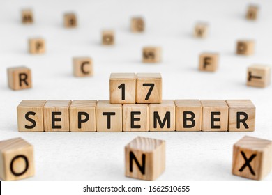 September 17 - from wooden blocks with letters, important date concept, white background random letters around - Shutterstock ID 1662510655