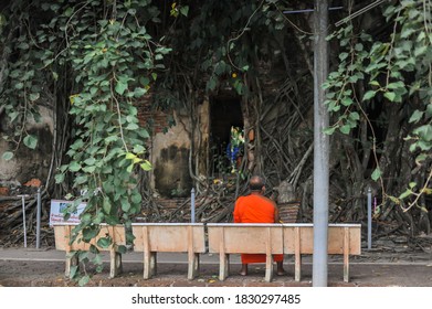 September 18, 2020 The Backside Of Monk Sat On A Chair Near The Ancient Church With Notice Board (Not Allowed To Sit On The Window) At Wat Bang Kung Temple In Samut Songkhram Province, Thailand