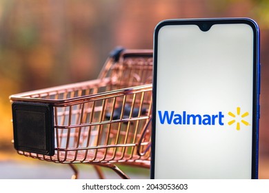 September 18, 2021, Brazil. In this photo illustration the Walmart logo displayed on a smartphone along with a shopping cart