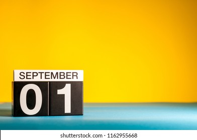 September 1st. Day 1 Of Month, Back To School Concept. Calendar On Teacher Workplace Yellow Background. Autumn Time. Empty Space For Text