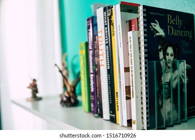 September 20, 2019 Cumberland Rhode Island USA. Book Shelf Educational And Self Help Book Stack Collection. Fairy And Weights Decorating Shelf.