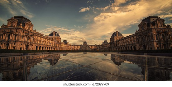 September 2016 - Le Louvre Museum Reflection On The Pyramid Glass In Paris, France