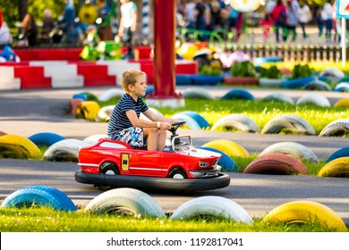 September 2018, Divo Osrtrov Amusement Park. Saint-Petersburg, Russia. Child In The Car On The Traffic Playground. Educational Place For Kids To Learn About Road Safety And Traffic Rules