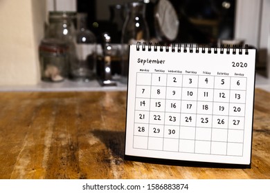 September 2020 Calendar - Month Page On Wooden Table In The Kitchen