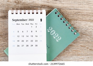 The September 2022 desk calendar on wooden background. - Shutterstock ID 2139972665
