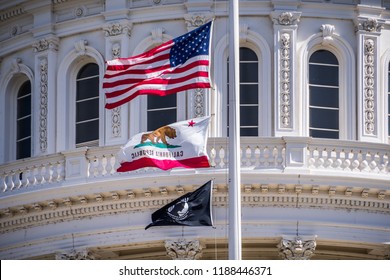 September 22, 2018 Sacaramento / CA / USA - The US Flag, The California Flag And The POW-MIA Flag Waving In The Wind In Front Of The Capitol State Building In Downtown Sacramento