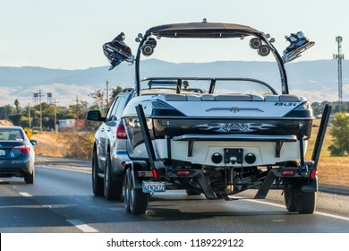 September 23, 2018 Stockton / CA / USA - Truck Towing Boat On The Interstate