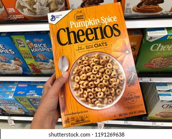 SEPTEMBER 25 2018 - CRYSTAL, MN: Customer Holds Up A Box Of Pumpkin Spice Flavored Cheerios By General Mills, In A Supermarket. This Is A Limited Edition Special Flavor For Fall