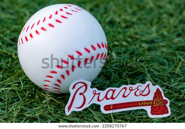 September 26, 2022,\
Cooperstown, New York. The emblem of the Atlanta Braves baseball\
club and a baseball.