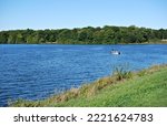September 28, 2022. Shabbona Lake State Park, Shabbona, Illinois, USA. Two people in a boat on the beautiful lake.
