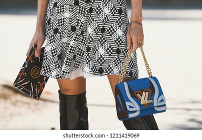 September 29, 2018: Paris, France - Girl wearing a stylish Louis Vouitton hand bag after a fashion show during Paris Fashion Week  - PFWSS19