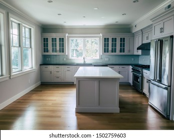 September 4th, 2019. Wakefield Rhode Island USA. Kitchen Interior And Window View Of A High End New Construction Energy Efficient Home. Showcasing Stove, Counter Top, Cabinets And Refrigerator. 